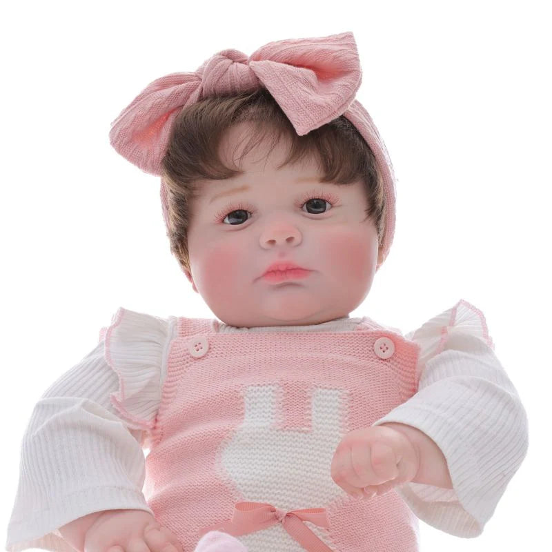 Muñeca bebé de vinilo realista de 26 pulgadas/65 cm con conjunto rosa y diadema con lazo – Muñeca coleccionable pintada a mano con ojos marrones