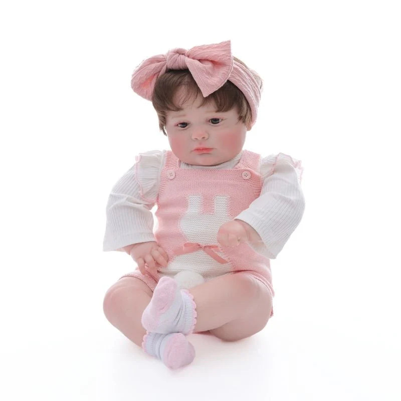 Muñeca bebé de vinilo realista de 26 pulgadas/65 cm con conjunto rosa y diadema con lazo – Muñeca coleccionable pintada a mano con ojos marrones