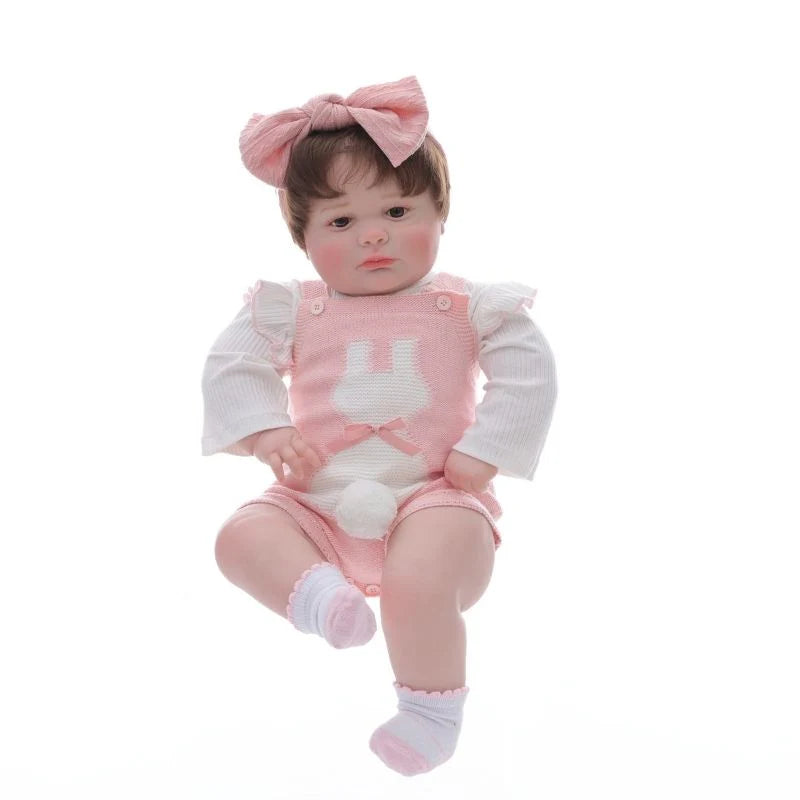 Muñeca bebé de vinilo realista de 26 pulgadas/65 cm con conjunto rosa y diadema con lazo – Muñeca coleccionable pintada a mano con ojos marrones