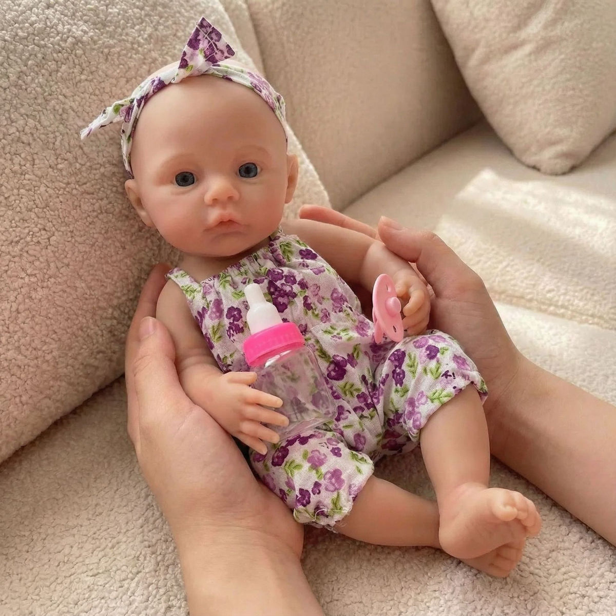 Muñeca reborn de silicona sólida de 12 pulgadas con diseño de flores prensadas en el prado