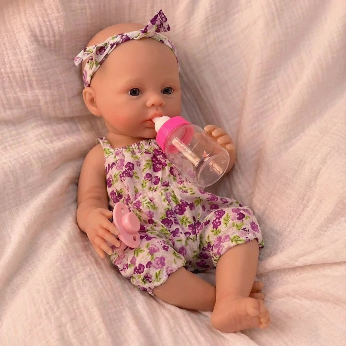Muñeca reborn de silicona sólida de 12 pulgadas con diseño de flores prensadas en el prado