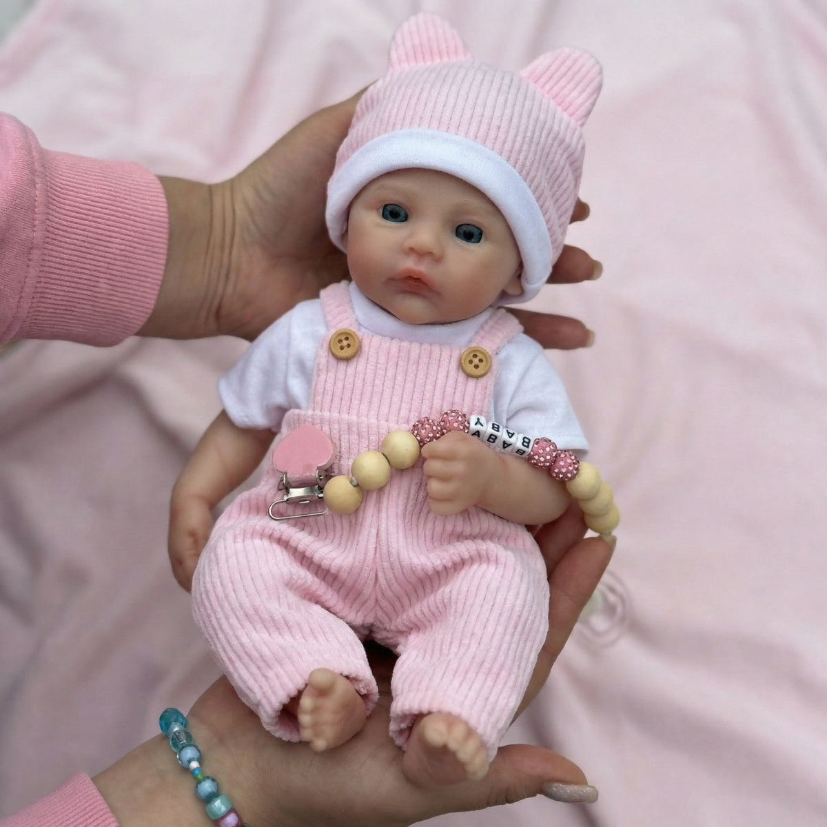 Muñeca reborn Meadow de silicona pura de 12 pulgadas con peto de rayas rosas