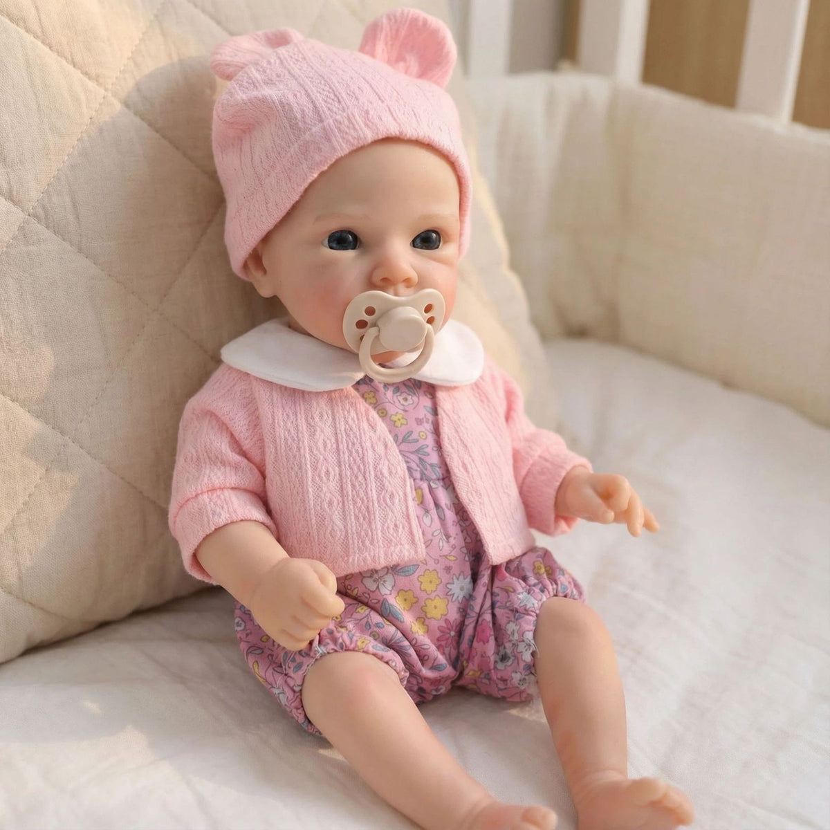 Muñeca reborn de silicona de 12 pulgadas con chaqueta rosa y estampado floral pequeño