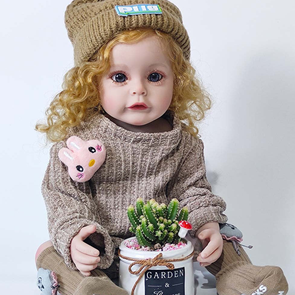 Muñeca Reborn de 22 pulgadas con sensor de sonido, disponible en versiones de cuerpo completo de vinilo y de tela, una compañera de juego ideal para niños y coleccionistas adultos en ocasiones especiales.