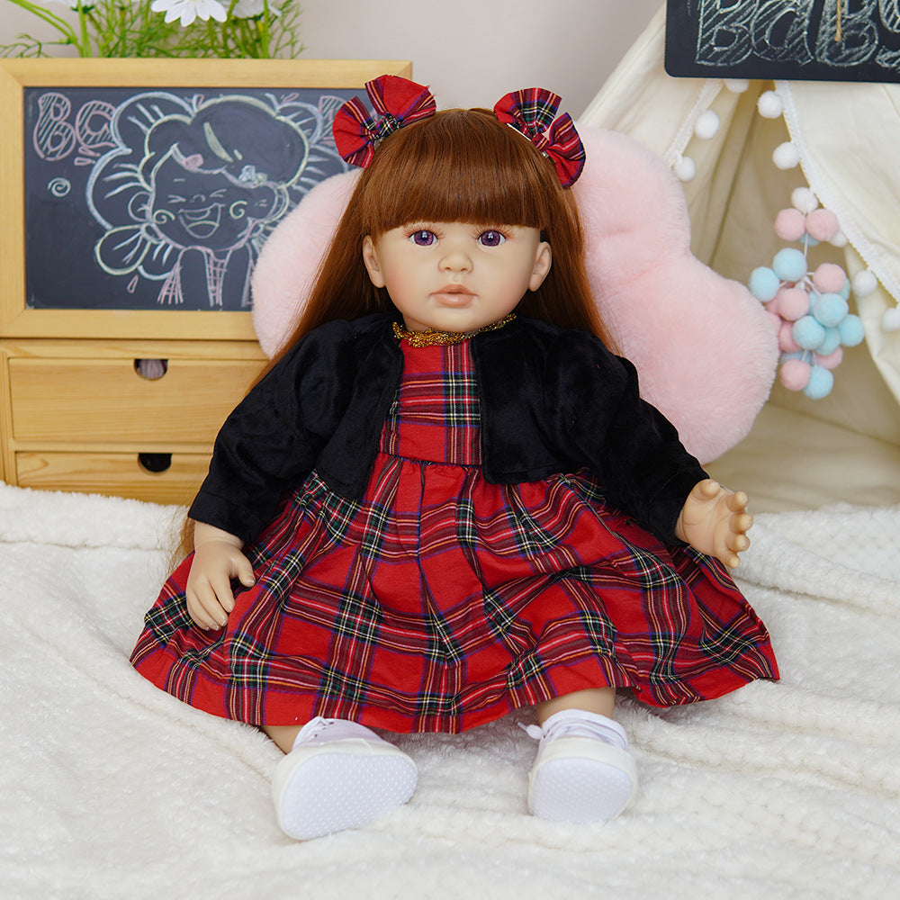Muñeca Reborn de 22 pulgadas con sensor de sonido, disponible en versiones de cuerpo completo de vinilo y de tela, una compañera de juego ideal para niños y coleccionistas adultos en ocasiones especiales.