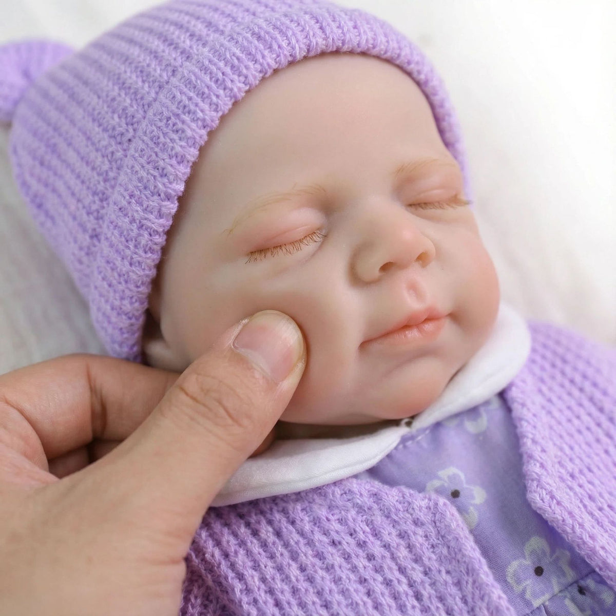 Muñeca reborn de silicona sólida Pascale de 12 pulgadas con cárdigan morado como regalo de Navidad para niños