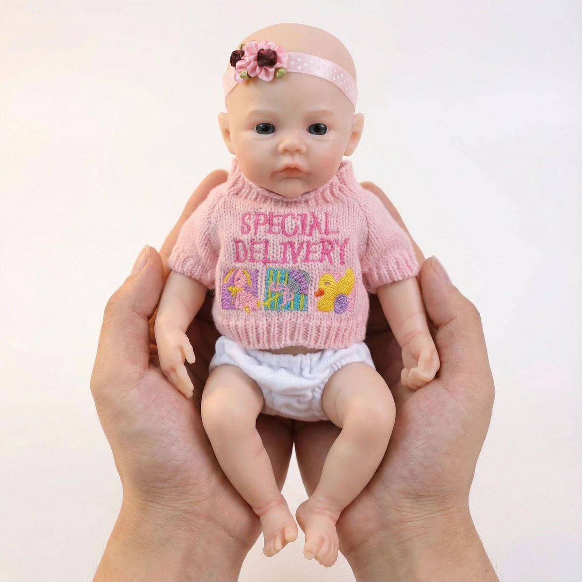 Top de suéter rosa de 12 pulgadas con muñeca de silicona maciza de reencarnación de prado como regalo de Navidad para niños
